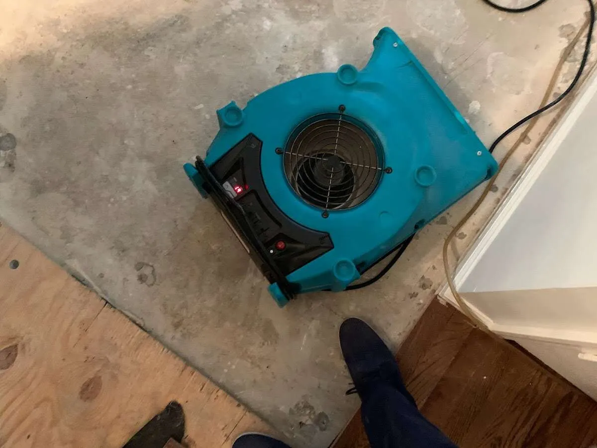 Air mover drying subfloor during Leak Detection & Repair in Winthrop Harbor
